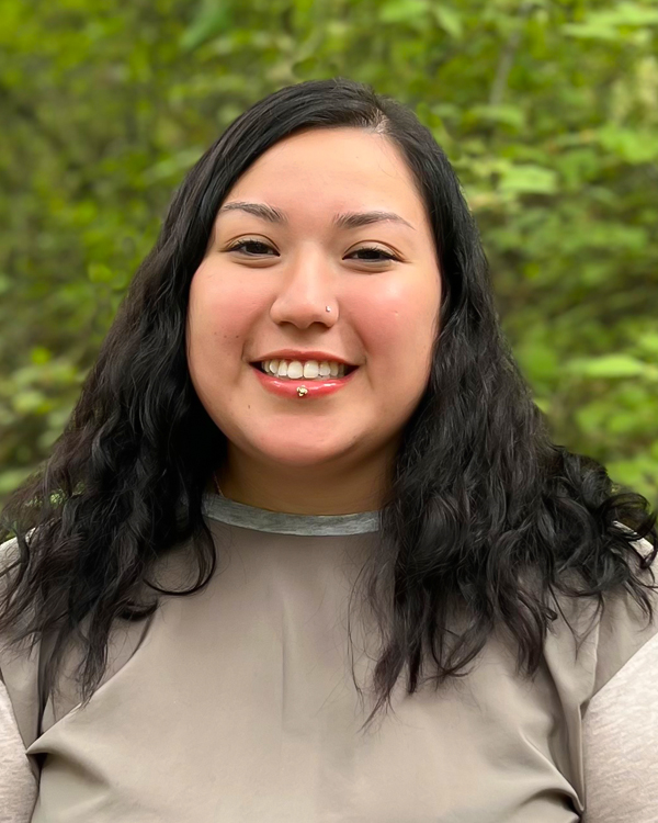 a woman, Haley Olmos, smiling