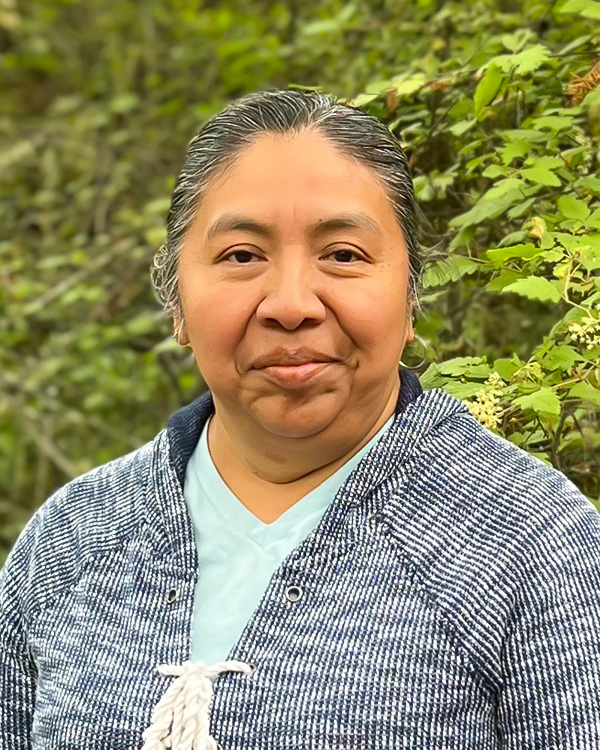 a woman, Petra Ramos, smiling