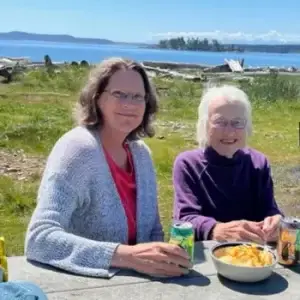 Island neighbors sitting at picnic table Jackson's beach