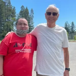 two men with arms around each other